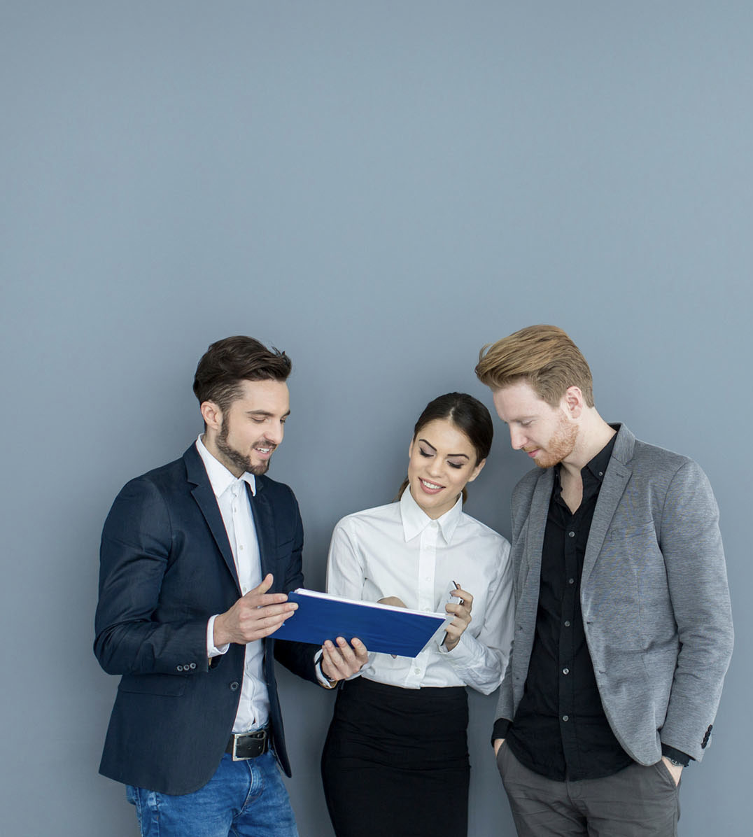 Three colleagues in conversation.