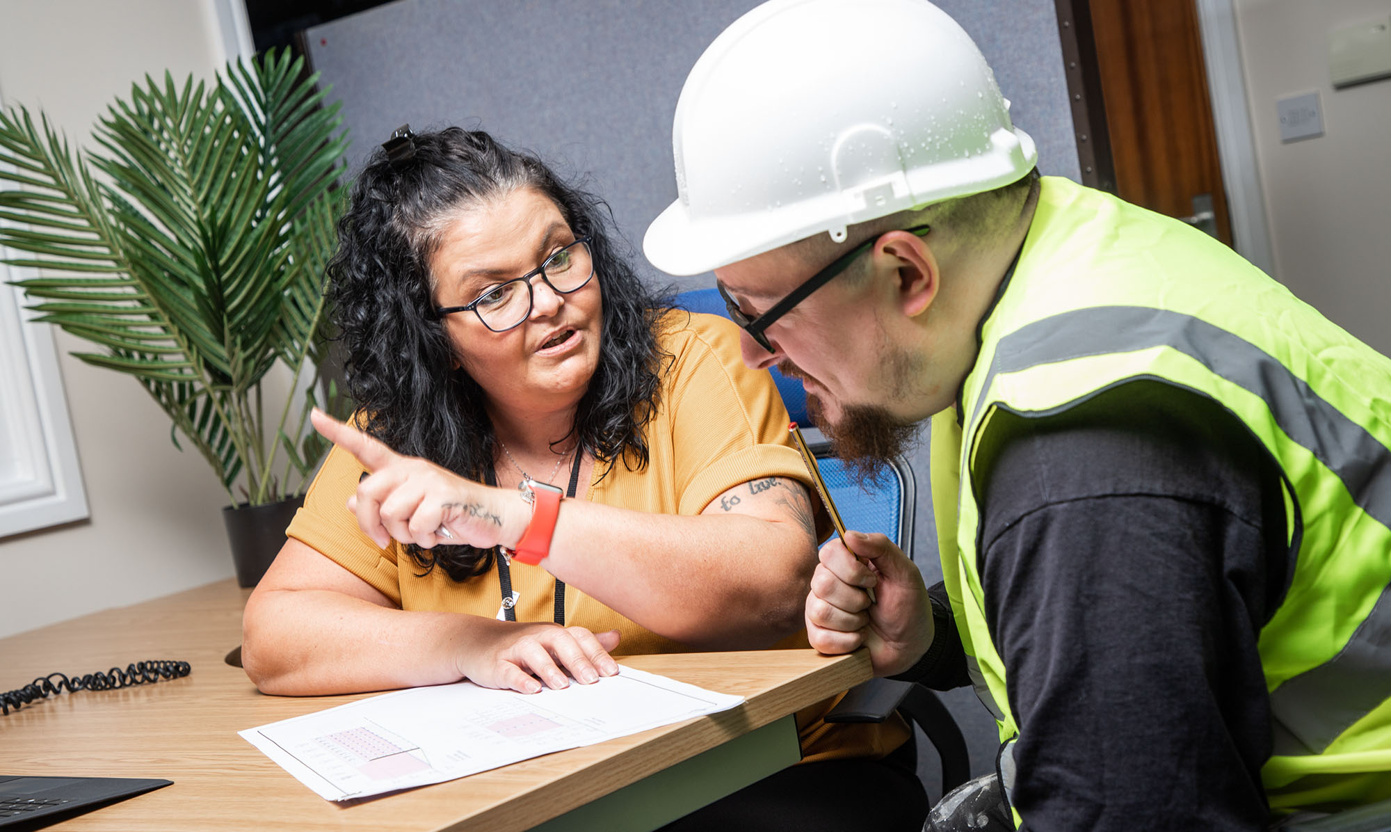 Recruiter and construction worker in conversation