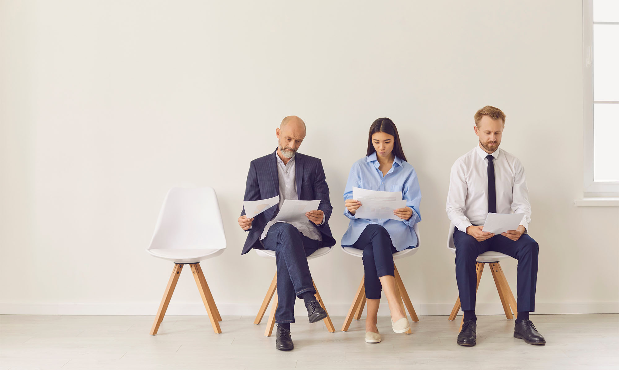 Job candidates sitting down, waiting to be interviewed